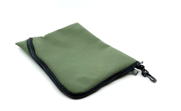 An A5 Ghost Whale Pouch in Boreal (green).